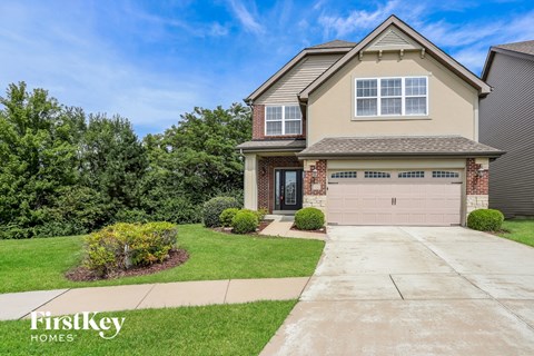a house with a driveway and a garage door