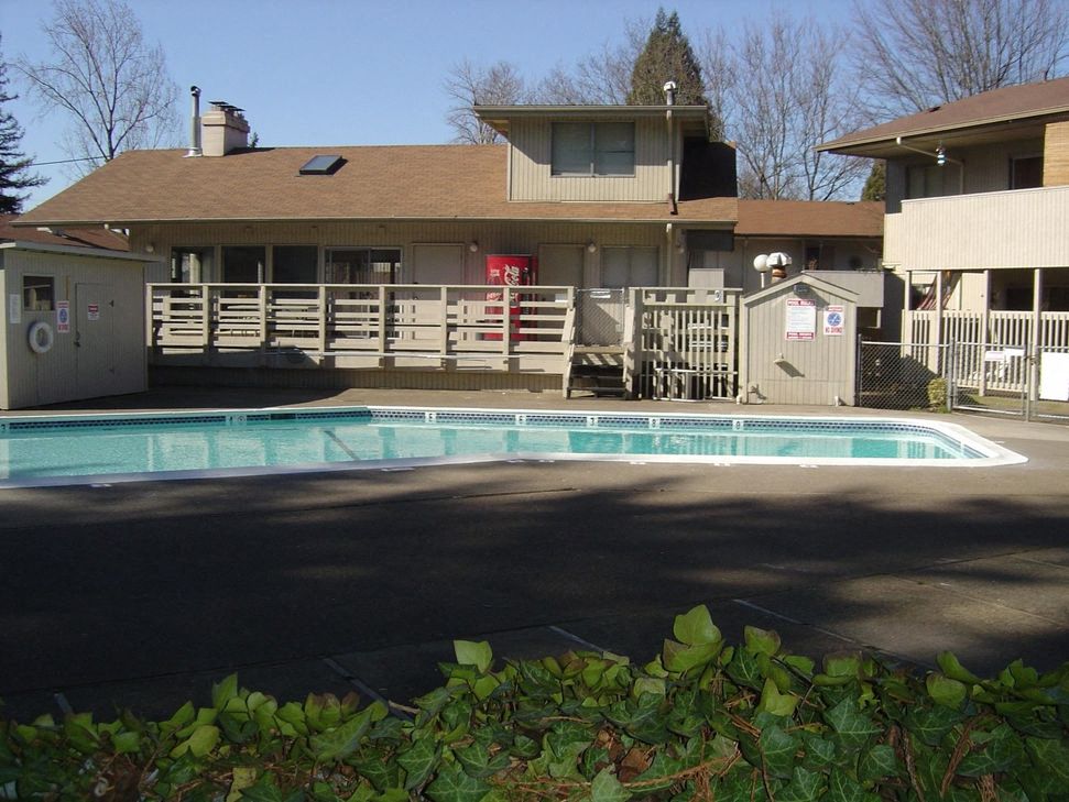 a swimming pool in front of a house