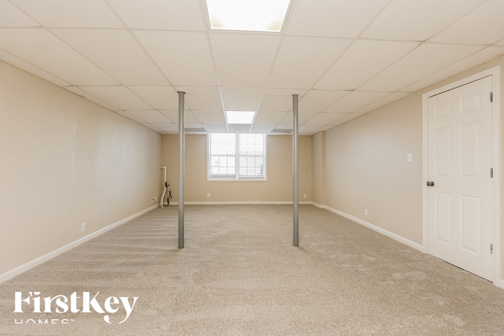a room with a carpeted floor and a window