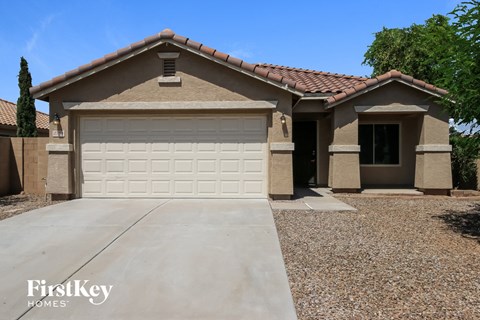 a house with a white garage door in front of it