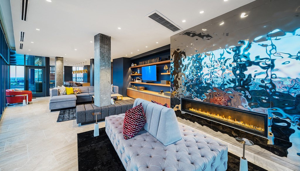 a living room with a couch and a fireplace