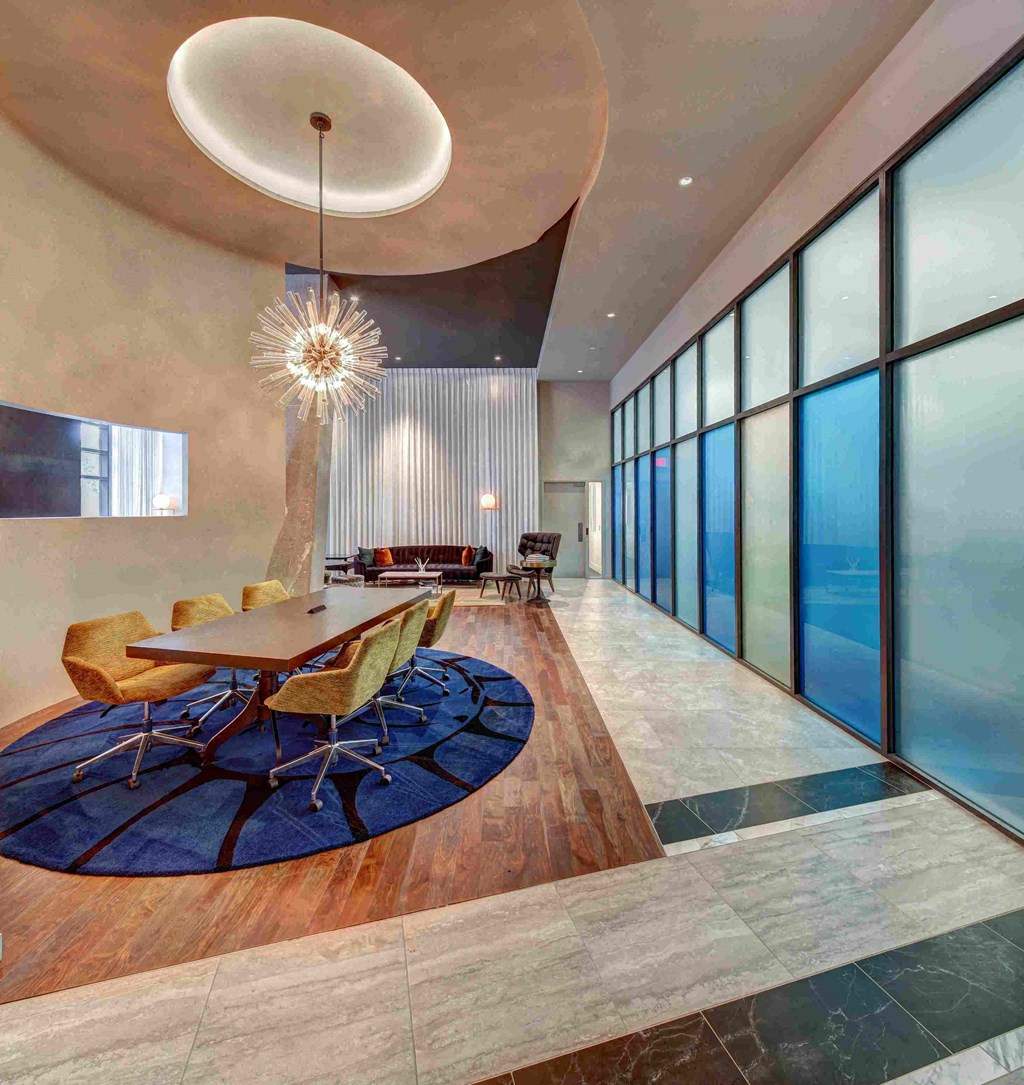 a dining room with a table and chairs in a lobby