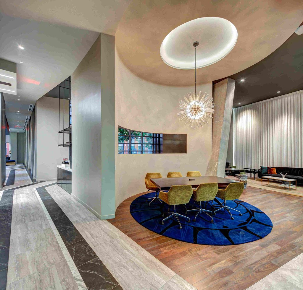 a dining room with a table and chairs in a lobby