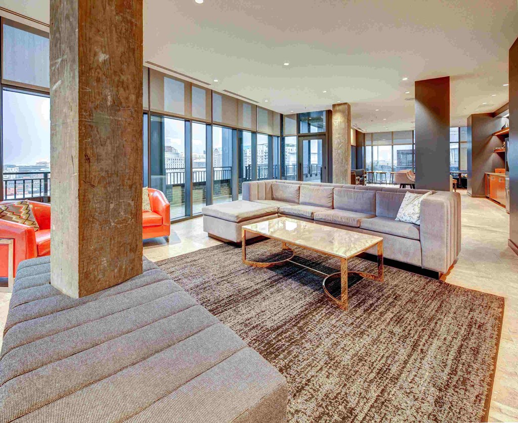 a large living room with couches and a coffee table