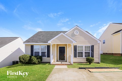 a home with a front porch and a lawn
