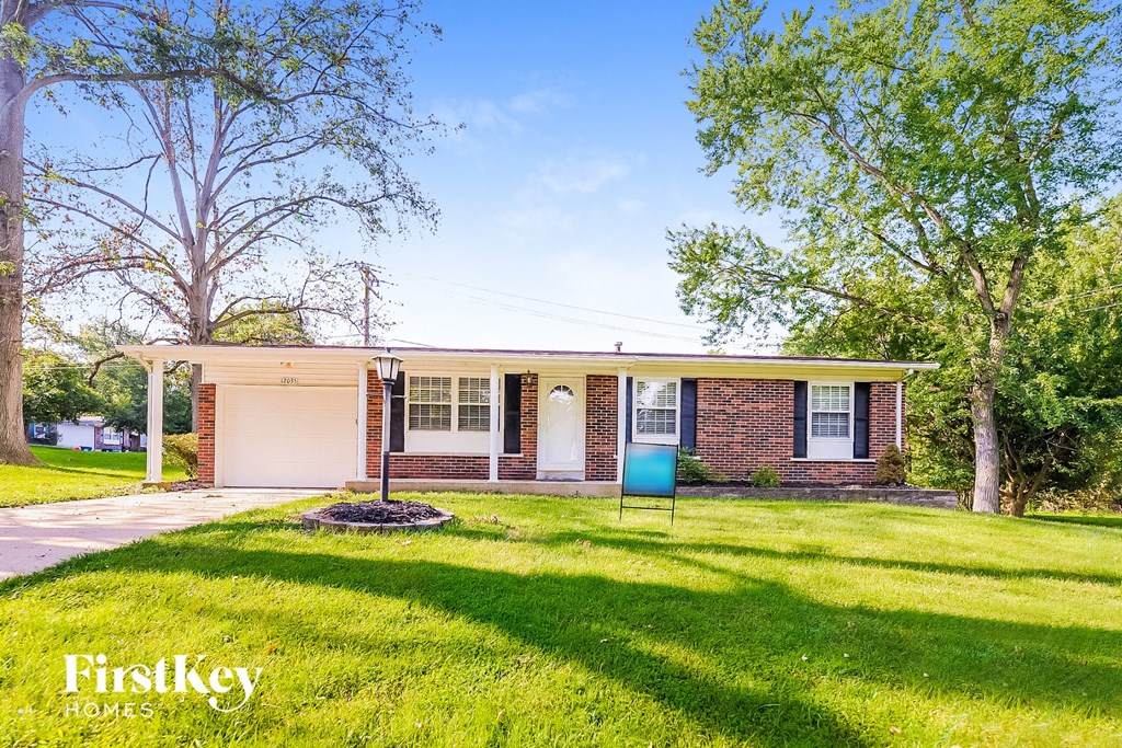 A house with a lawn in front of it.