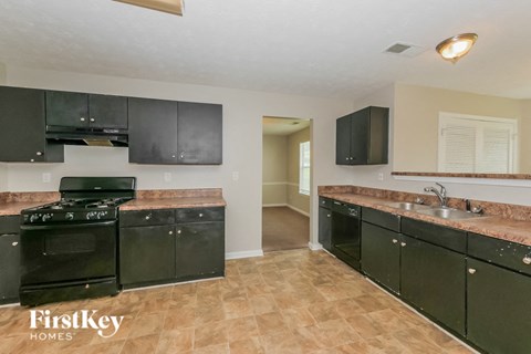 the kitchen is clean and ready to use with black appliances