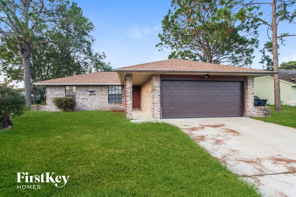 a home with a driveway and a garage door