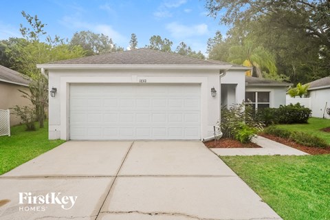 a white house with a white garage door