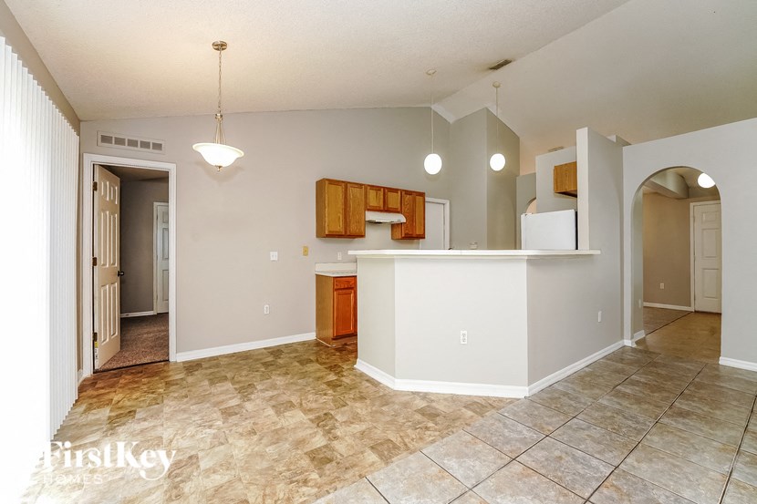 a kitchen and living room with an open floor plan