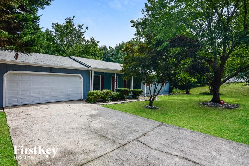 a blue house with a white garage door