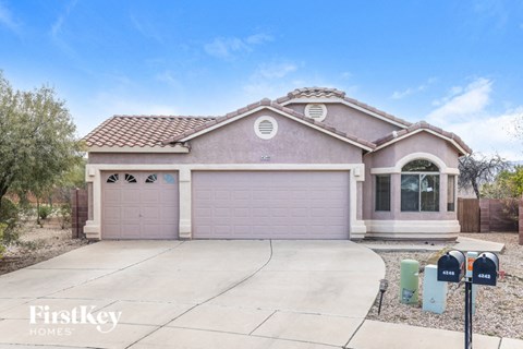 a house with a driveway and a garage door