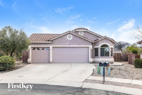 a house with a driveway and a garage door