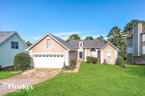 A house with a garage is for sale by FirstKey Homes.