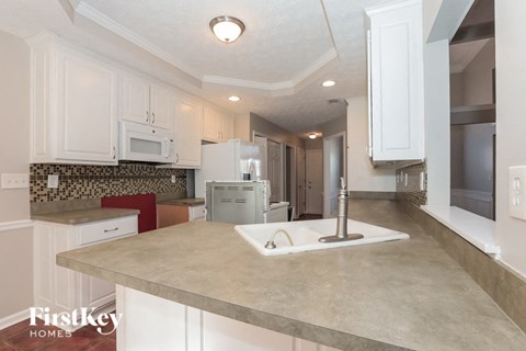 a kitchen with a sink and a counter top