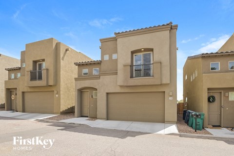 A row of houses with the words "FirstKey Homes" on the bottom left.