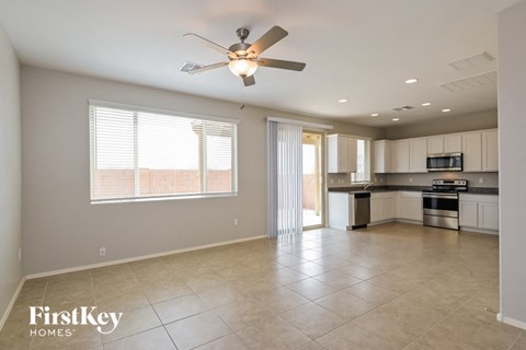 A spacious kitchen and living room with a FirstKey Homes logo.