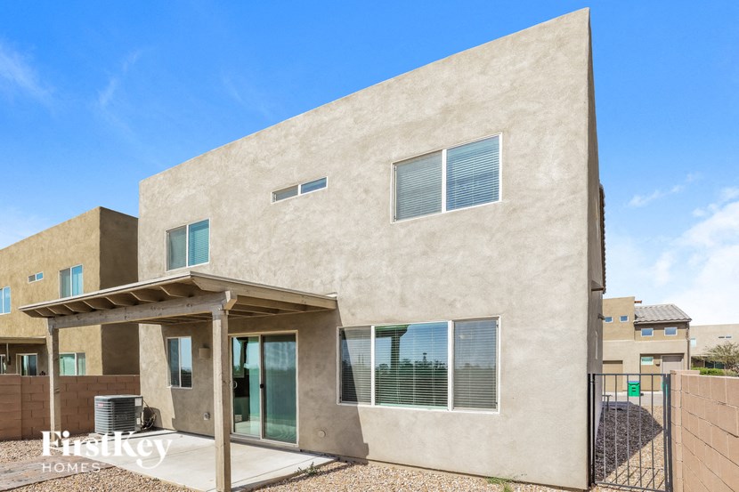 a view of the outside of a house with a gate