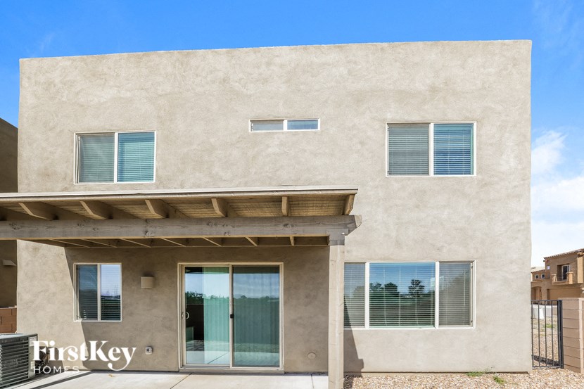the front of a building with a door and windows
