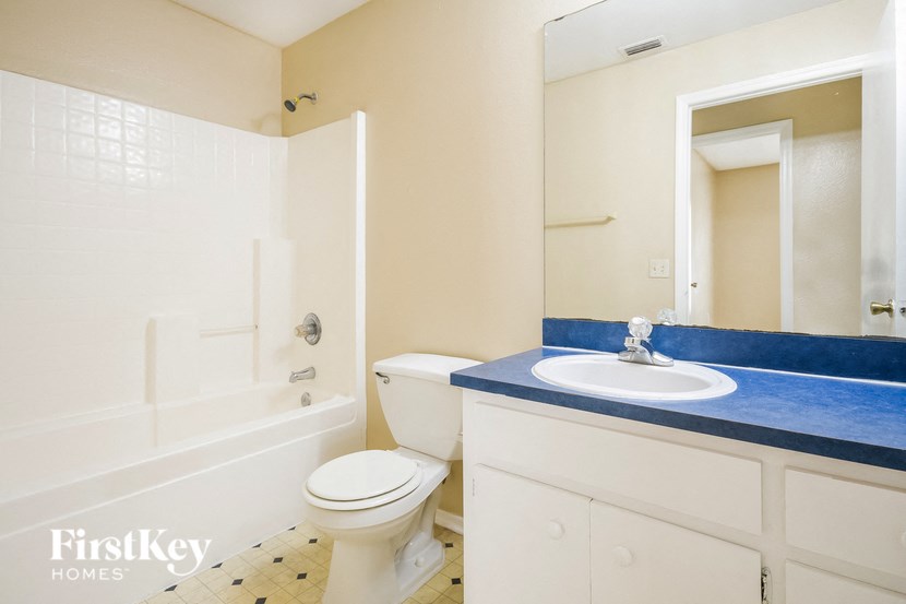 a bathroom with a sink toilet and a shower