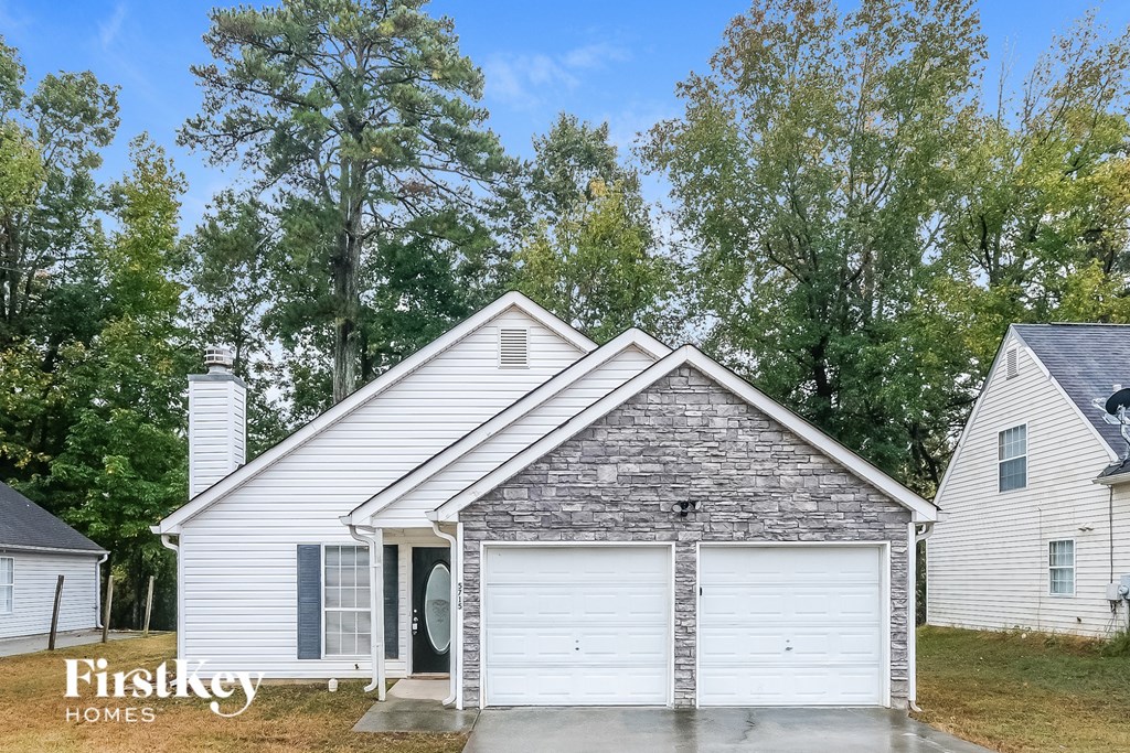 A house with a garage is for sale by FirstKey Homes.