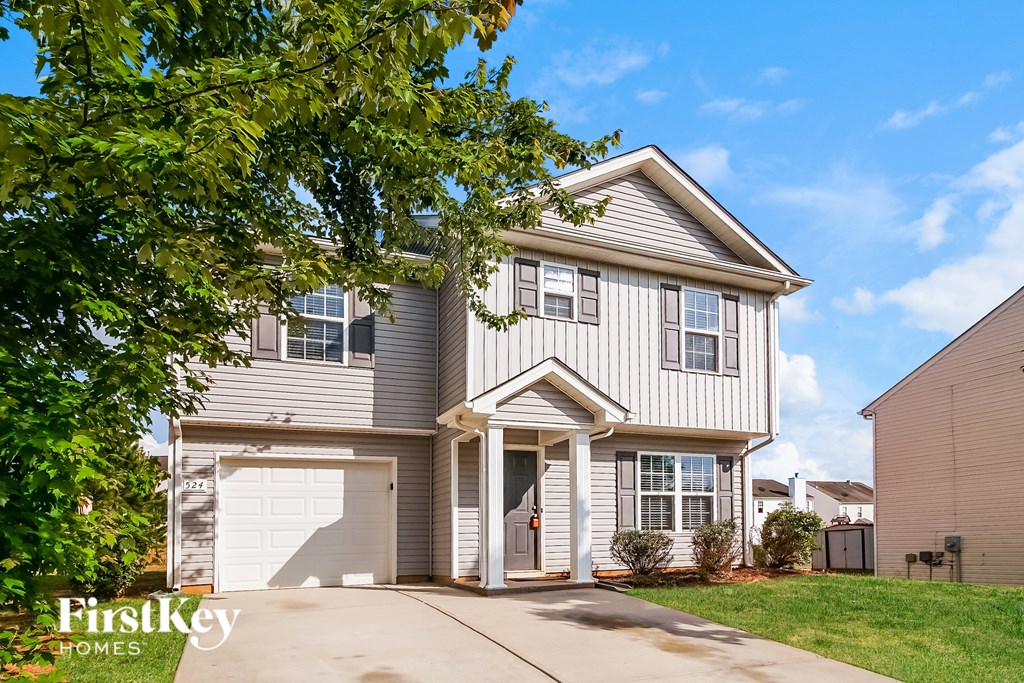 A house with a garage is for sale by FirstKey Homes.