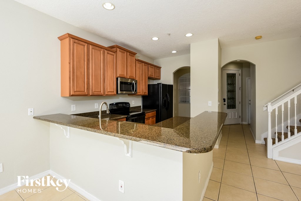 a kitchen with a granite counter top and