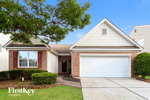 a brick house with a white garage door