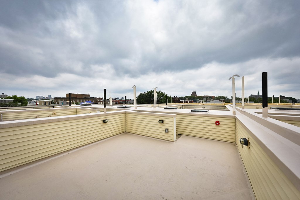 the roof of a building with a cloudy sky in the background