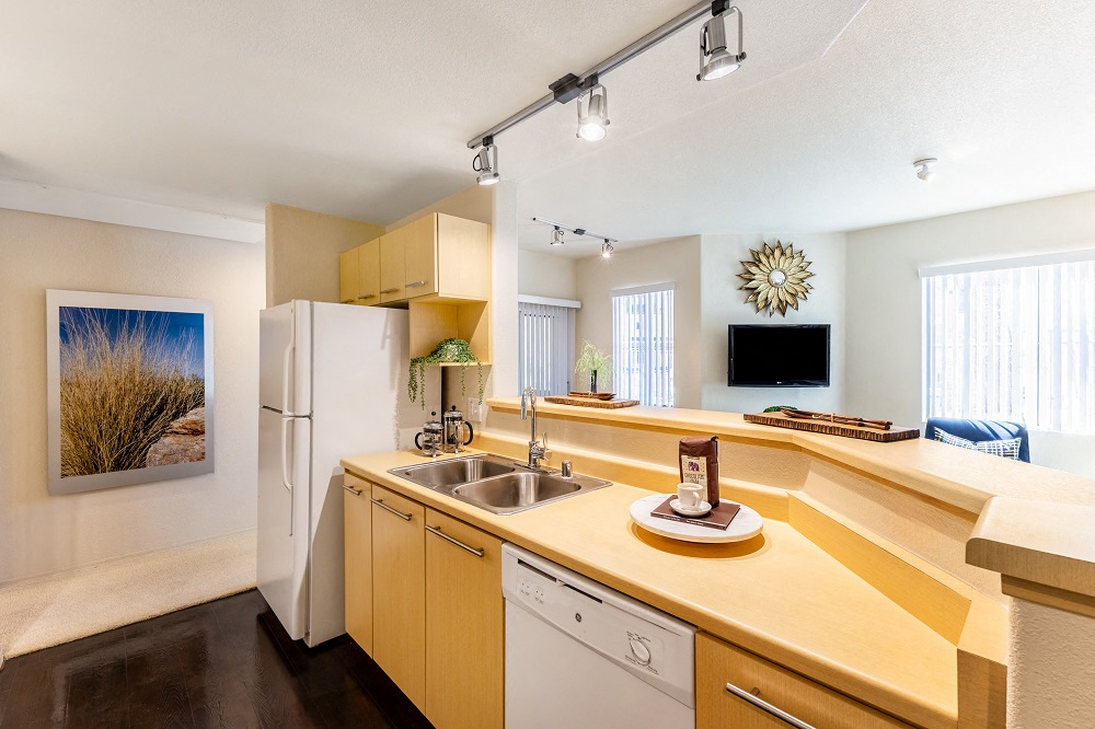 a kitchen with a sink and a refrigerator