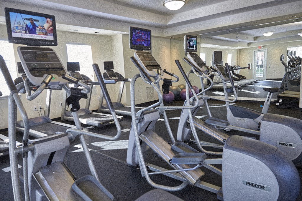 A gym with treadmills and exercise equipment.