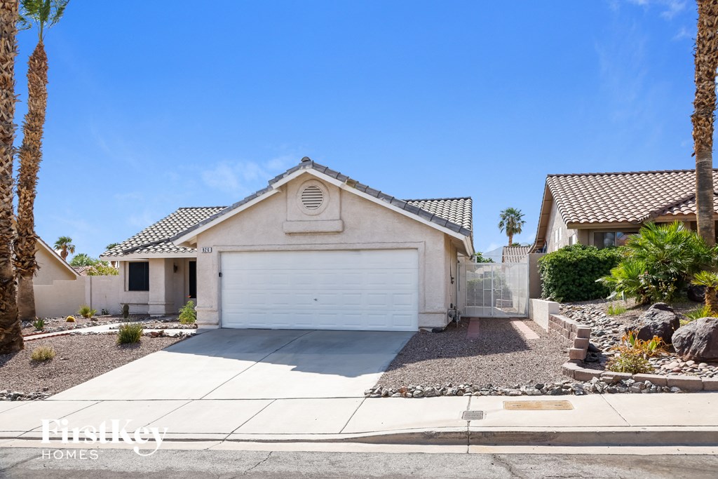 A house with a white garage door is for sale.
