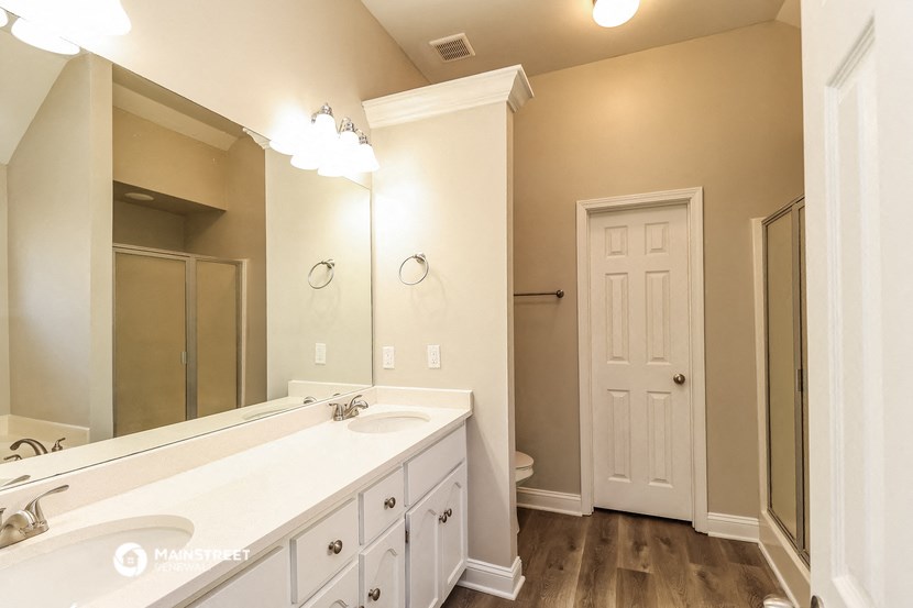 a bathroom with a large sink and a mirror