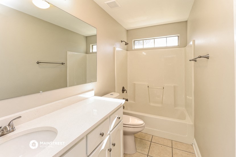 a bathroom with a sink toilet and a shower