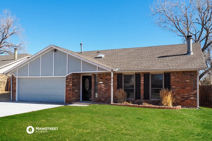 the front of a house with a lawn