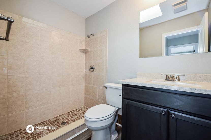 a bathroom with a toilet and a sink