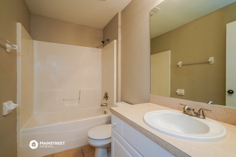 a bathroom with a sink toilet and a shower