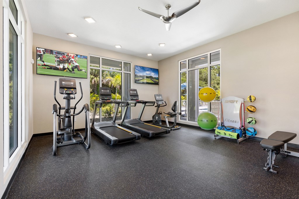 the gym with treadmills and weights at the preserve at greatstone