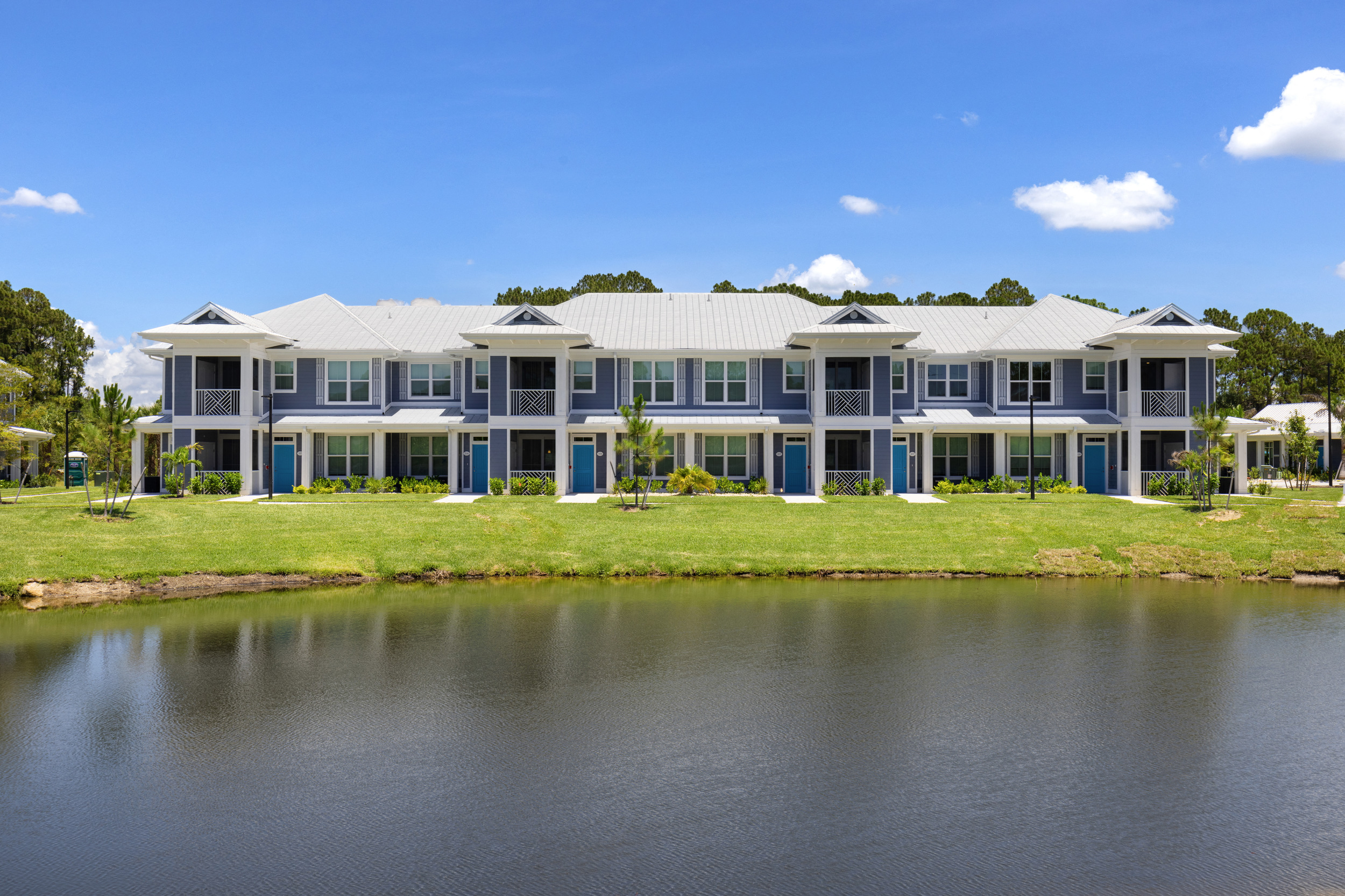 a large building with a lake in front of it