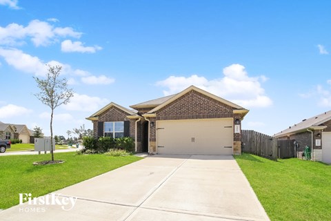 a house with a driveway and a garage door