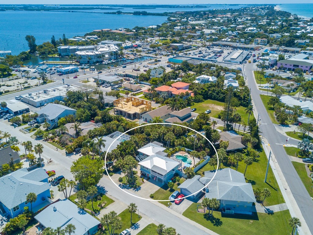 an aerial view of a neighborhood with a circle around a house