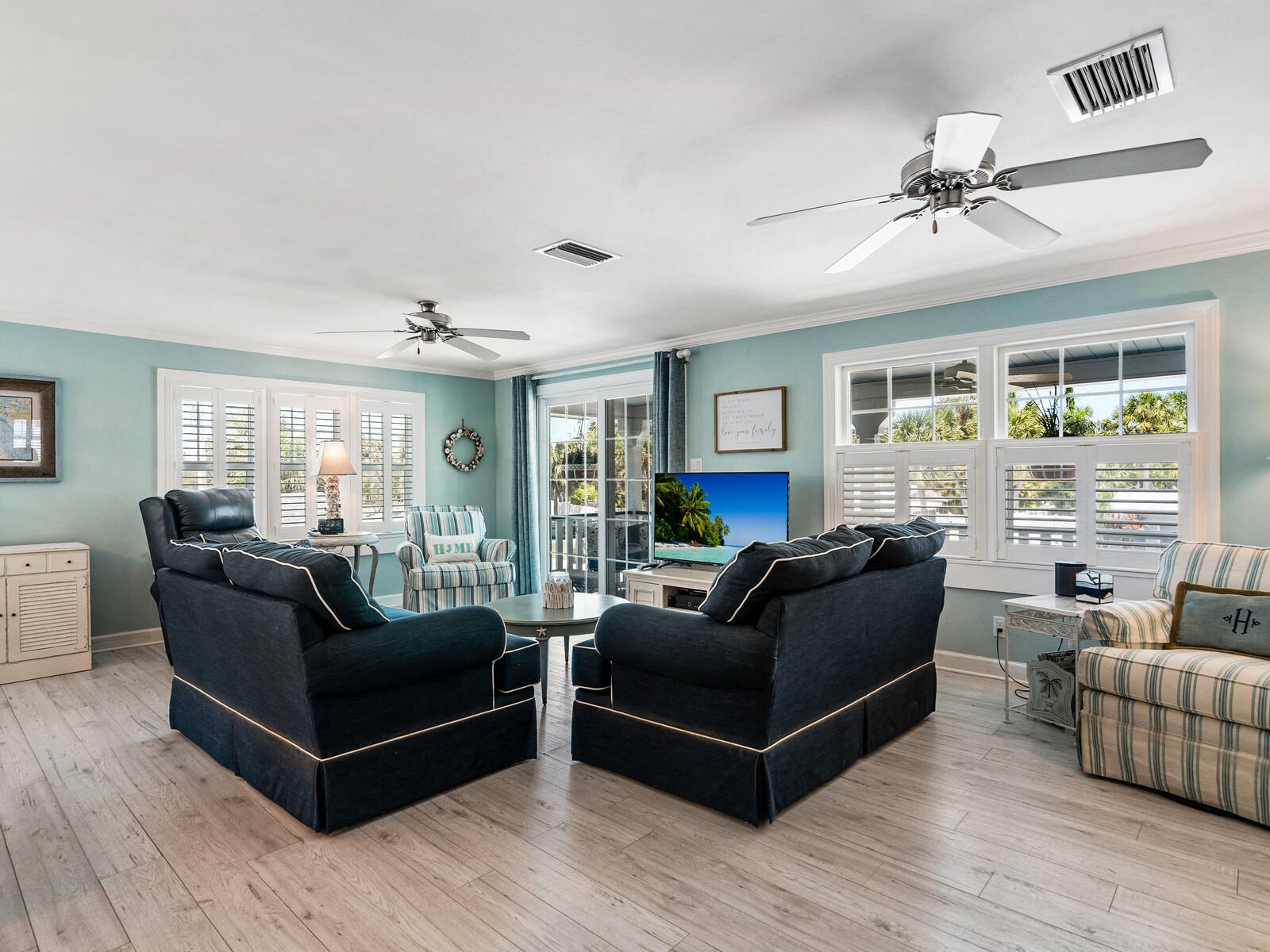 a living room with two couches and a glass table