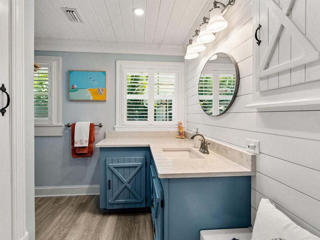 a small kitchen with blue cabinets and a sink