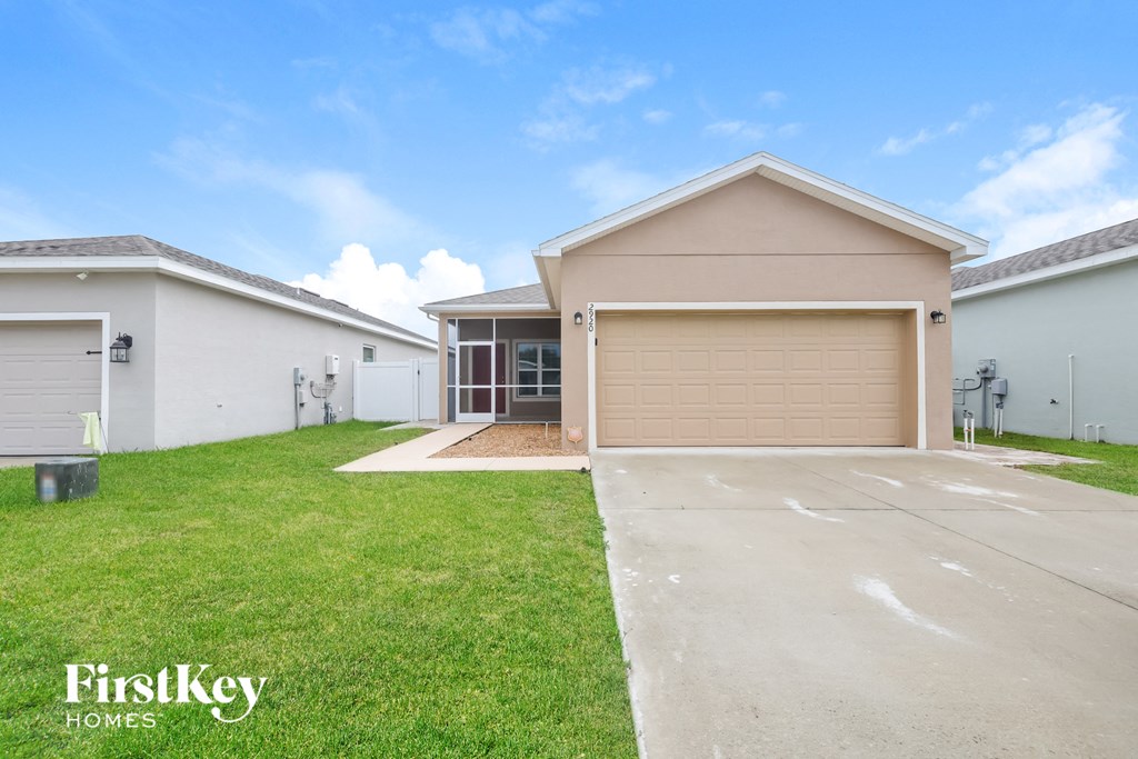 A house with a garage is for sale by FirstKey Homes.