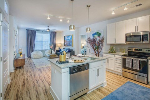 a kitchen and living room with a counter top