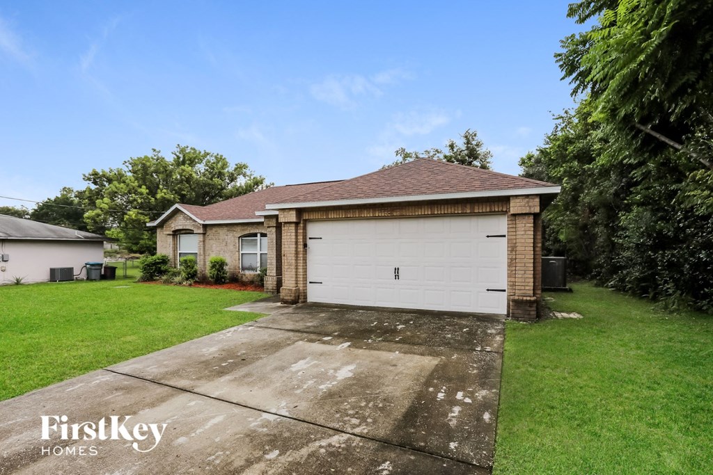 A house with a garage is for sale by FirstKey Homes.