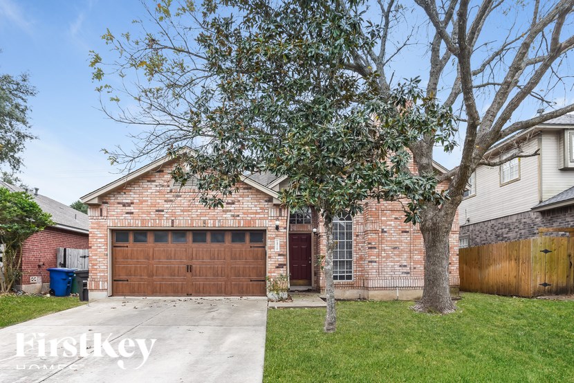 A house with a brown garage door is for sale.