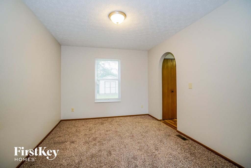 the master bedroom has a closet and a door to the ensuite bathroom