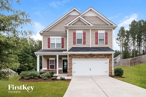 a house with a white garage door in front of it