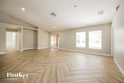 the living room and dining room are spacious and light wood flooring